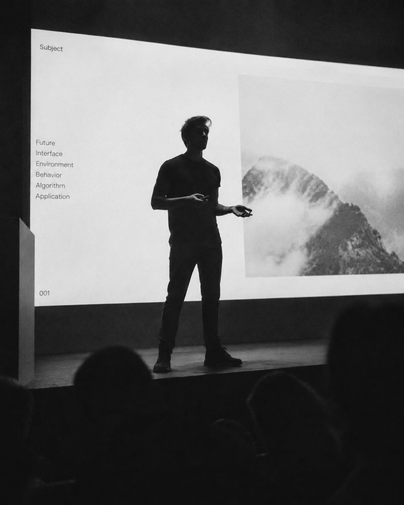 A young founder pitching on stage